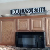 Farmhouse Style Signs - finished sign over the kitchen cabinets