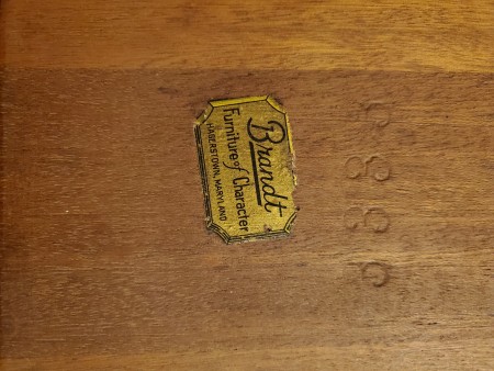 A Brandt label on the bottom of the table.