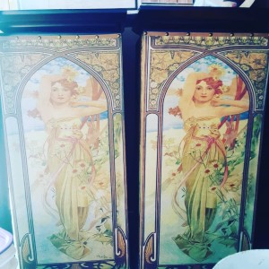 Two cabinet doors with a painted redheaded woman.