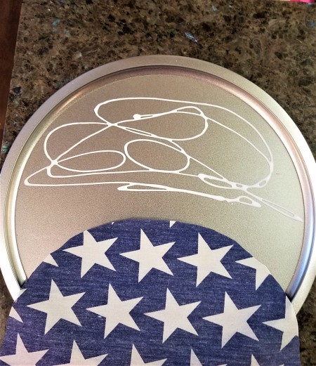 Pizza Pan Flag Wall Hanging - glue applied to top half of pan