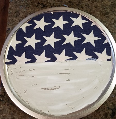 Pizza Pan Flag Wall Hanging - stars fabric half circle glued in place and glue added for strips once glue for stars dry