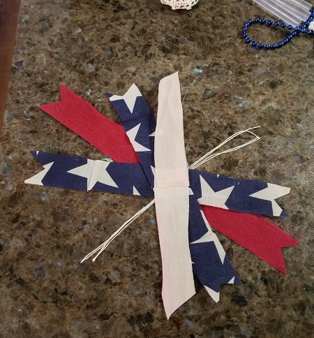 Pizza Pan Flag Wall Hanging - scraps of fabric and thread to tie