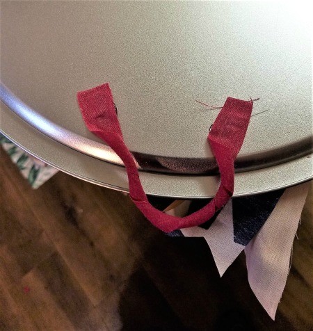 Pizza Pan Flag Wall Hanging - fabric strip glued to the back as a hanger