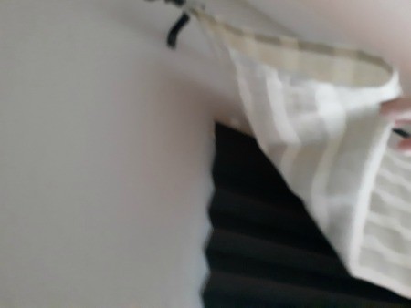 The black shade behind a fabric valance.