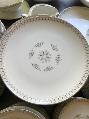 White china with a geometric print in grey.
