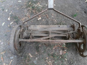 An old metal push mower.