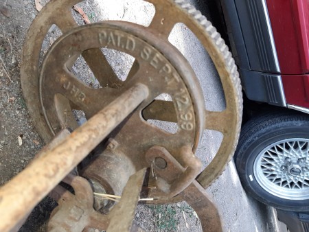 The patent number on the wheel of a push mower.