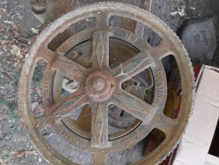The outer wheel of a push mower.