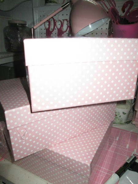 Pink and white shoe boxes for organzing.