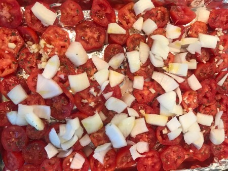 Onions and garlic added to the tomato slices.