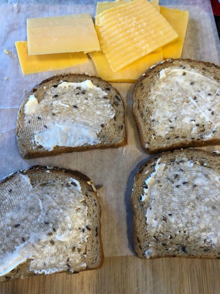 Making a grilled cheese sandwich to go with the soup.