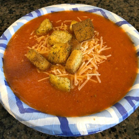 Tomato soup topped with croutons and cheese.