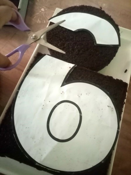 Number Cake Craft - placing number cutout on cake