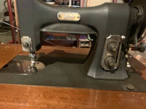 Value of a White Sewing Machine? - flat black rather plain sewing machine