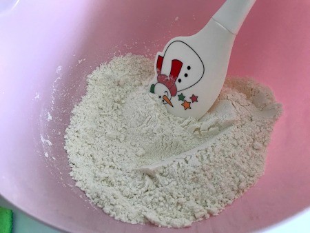 Dry ingredients being mixed together in a bowl.
