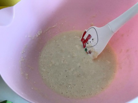 Adding wet ingredients to the bowl.
