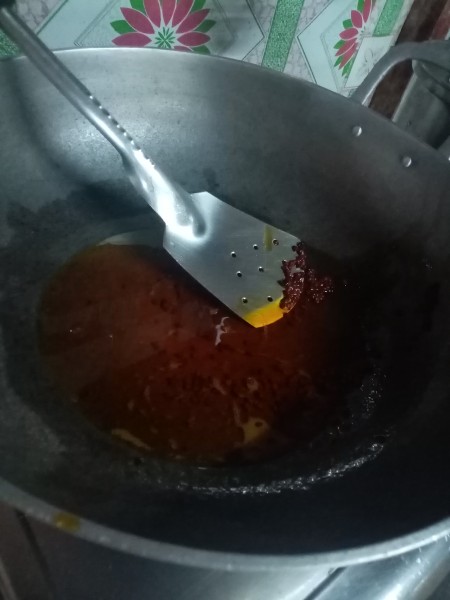 Annatto seeds cooked in oil.