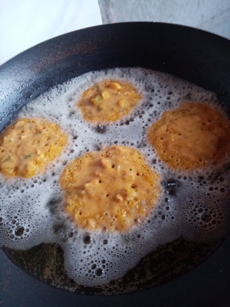 Frying the pancakes in a pan.