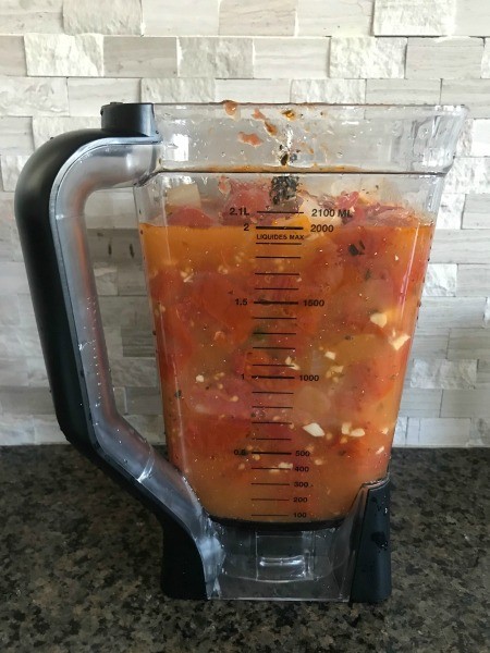 Adding ingredients to the blender.