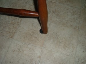A chair leg with a slipping slide on the bottom.