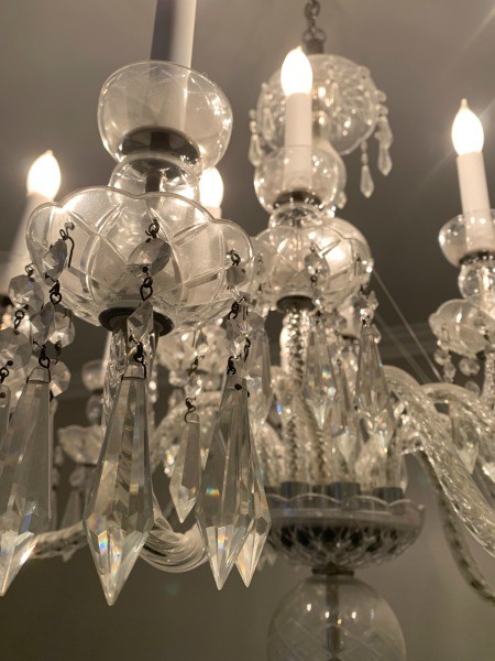 A crystal chandelier in a dining room.