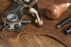 A collection of leatherworking tools.