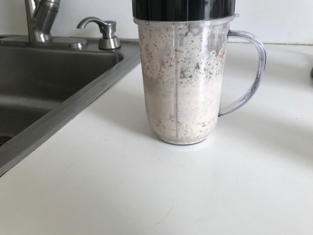 A blender cup filled with chia seed pudding.