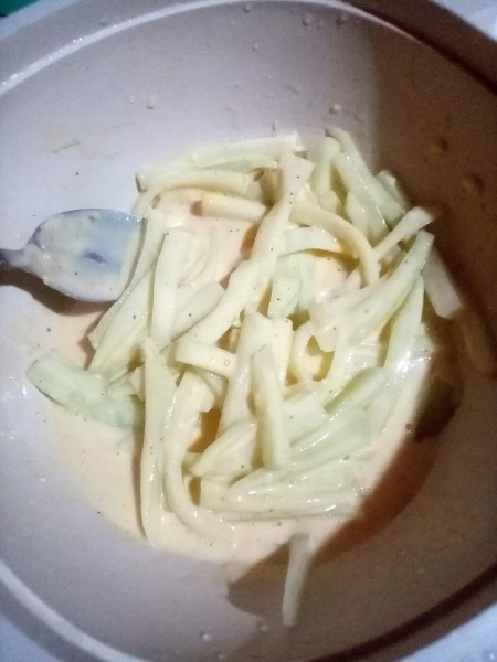 Thoroughly coating the chayote pieces.