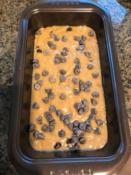 Unbaked almond butter chocolate chip bread in a loaf pan.