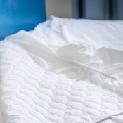 A mattress topper on a bed.