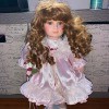 Value of a Brinn Porcelain Doll? - red haired doll in a pink dress
