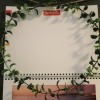 Dainty Wall Calendar Wreath  - wreath over the top page of a wall calendar