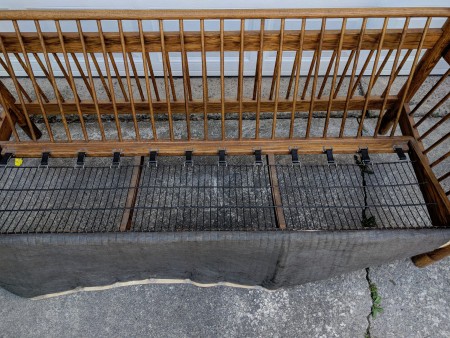 The wood frame of a sofa with the cushions removed.