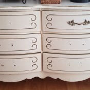 A white dresser with six drawers.