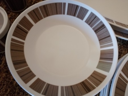 A china plate with a brown design.