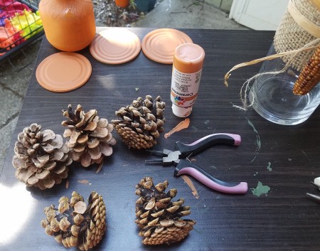 Fall Themed Glass Tube - breaking up pine cones