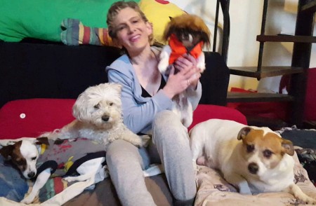 Slogan for Doggy Daycare and Boarding Business? - woman surrounded by dogs