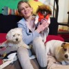 Slogan for Doggy Daycare and Boarding Business? - woman surrounded by dogs