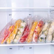 A freezer with packages of food.