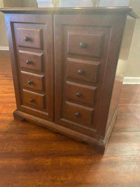 A radio phonograph cabinet.