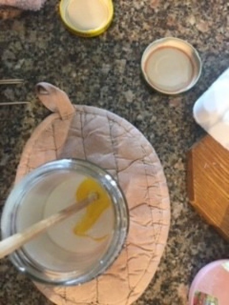 Citrus and Floral Homemade Soap - yellow dye being mixed into melted soap