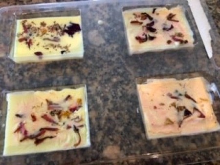 Citrus and Floral Homemade Soap - soap with dried flowers added, in molds
