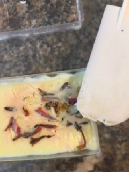 Citrus and Floral Homemade Soap - using a spatula to release molded soap