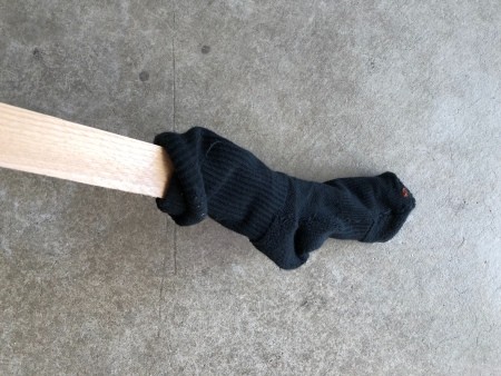A sock on a long pole.