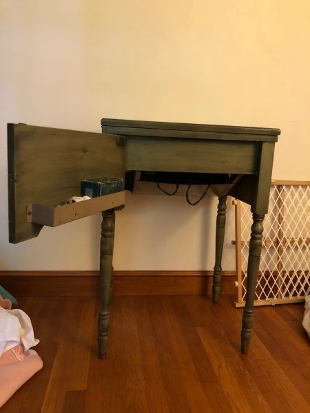 A White sewing machine table