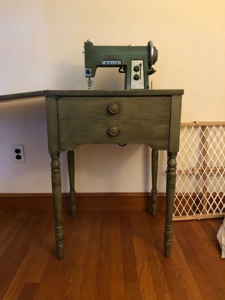 A White sewing machine table