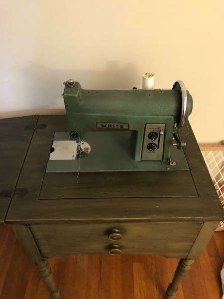 A White sewing machine table