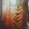 A wooden Art Deco wardrobe.