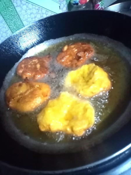 Frying the patties in oil.