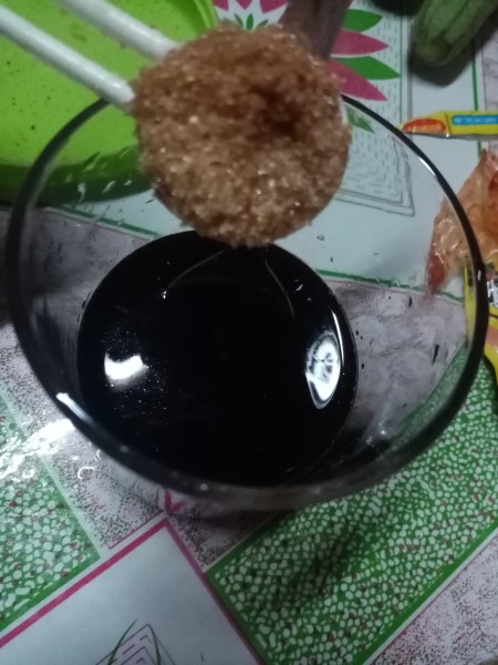 Adding ingredients to the barbecue sauce.